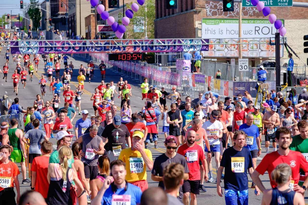 A crowd of people run down the street during the Bloomsday race in Spokane.