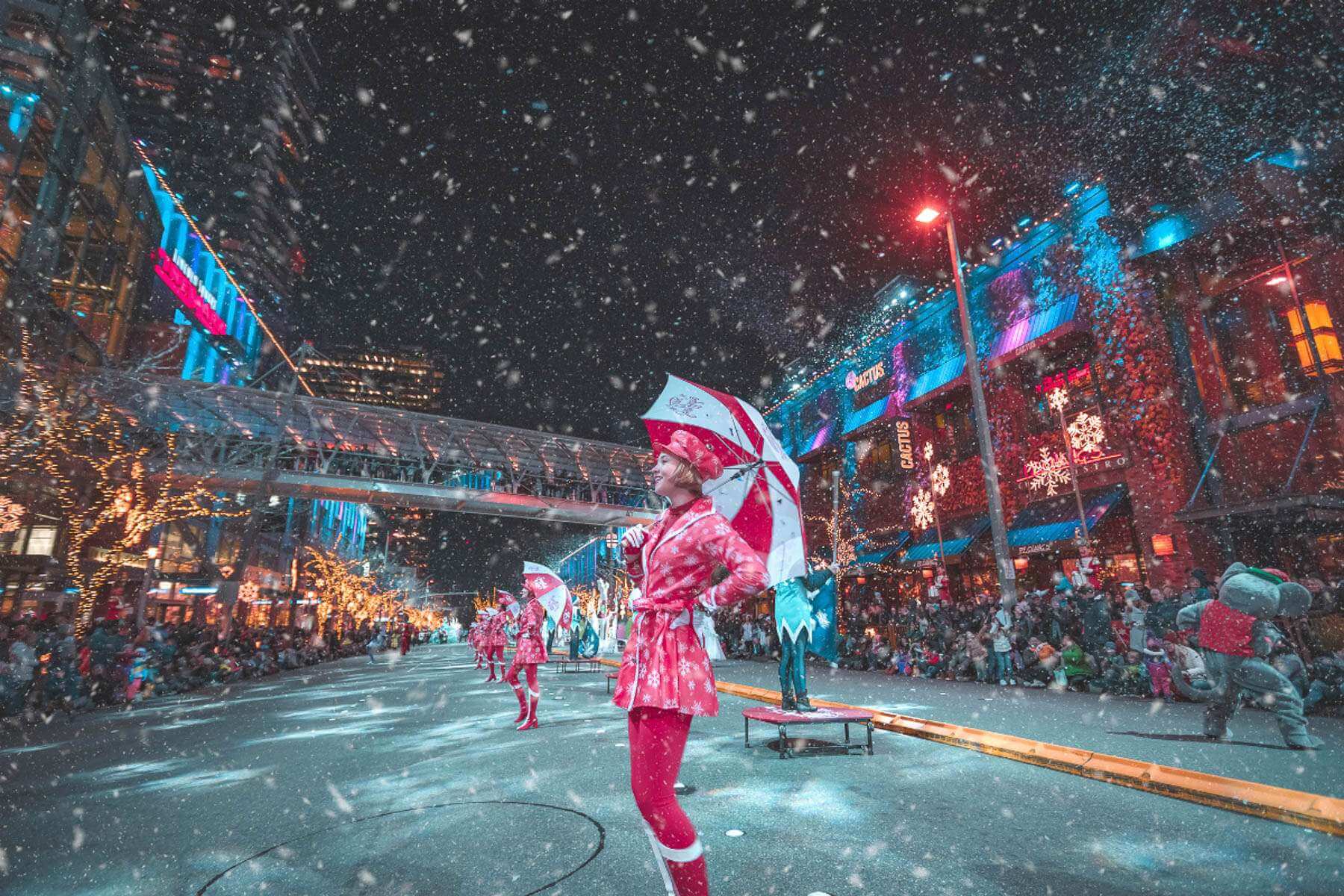 Photo of women dancing in the parade on Snowflake Lane, one of the holiday events in Washington