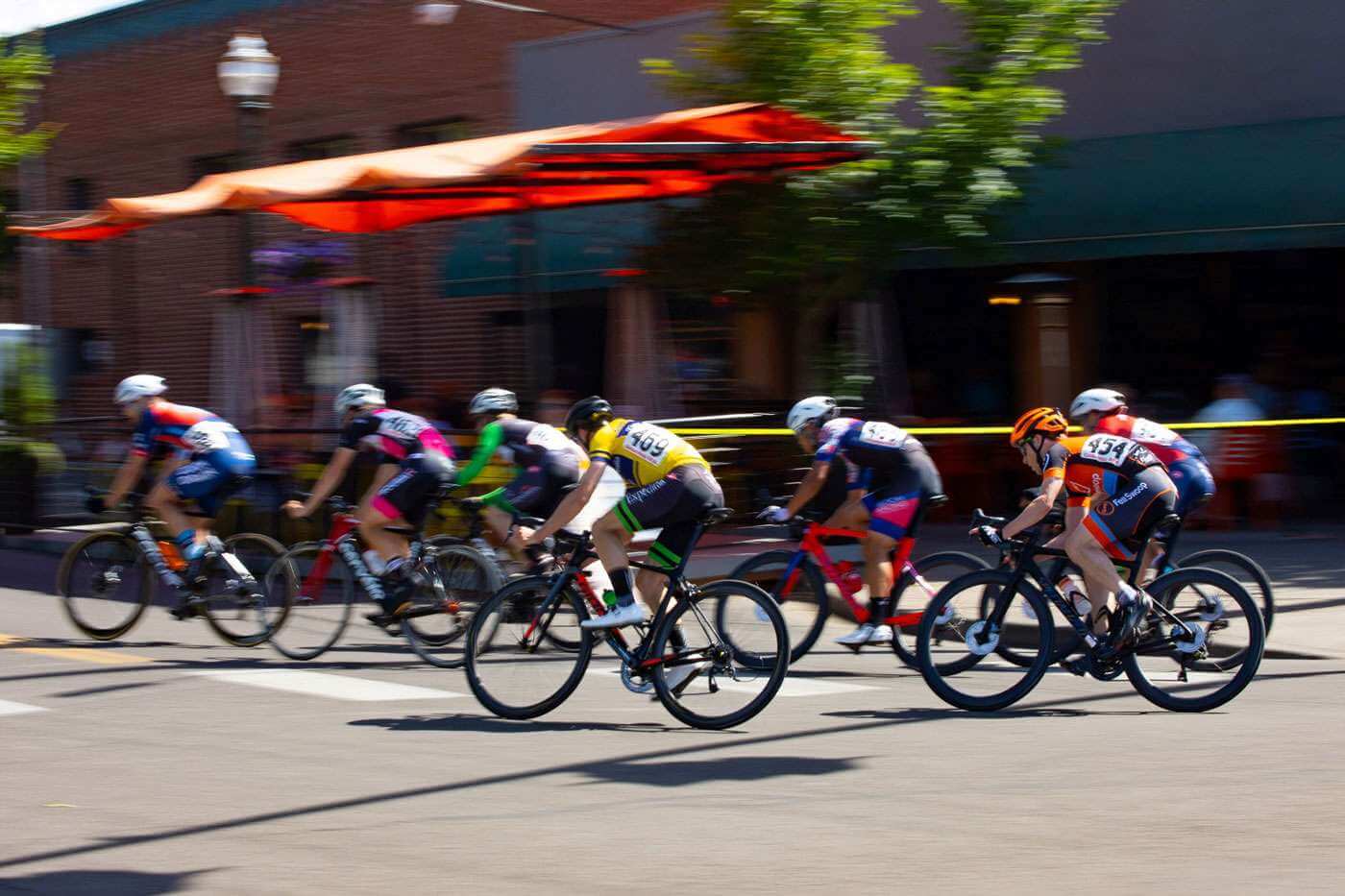 Cyclers ride down a street in Walla Walla Washington