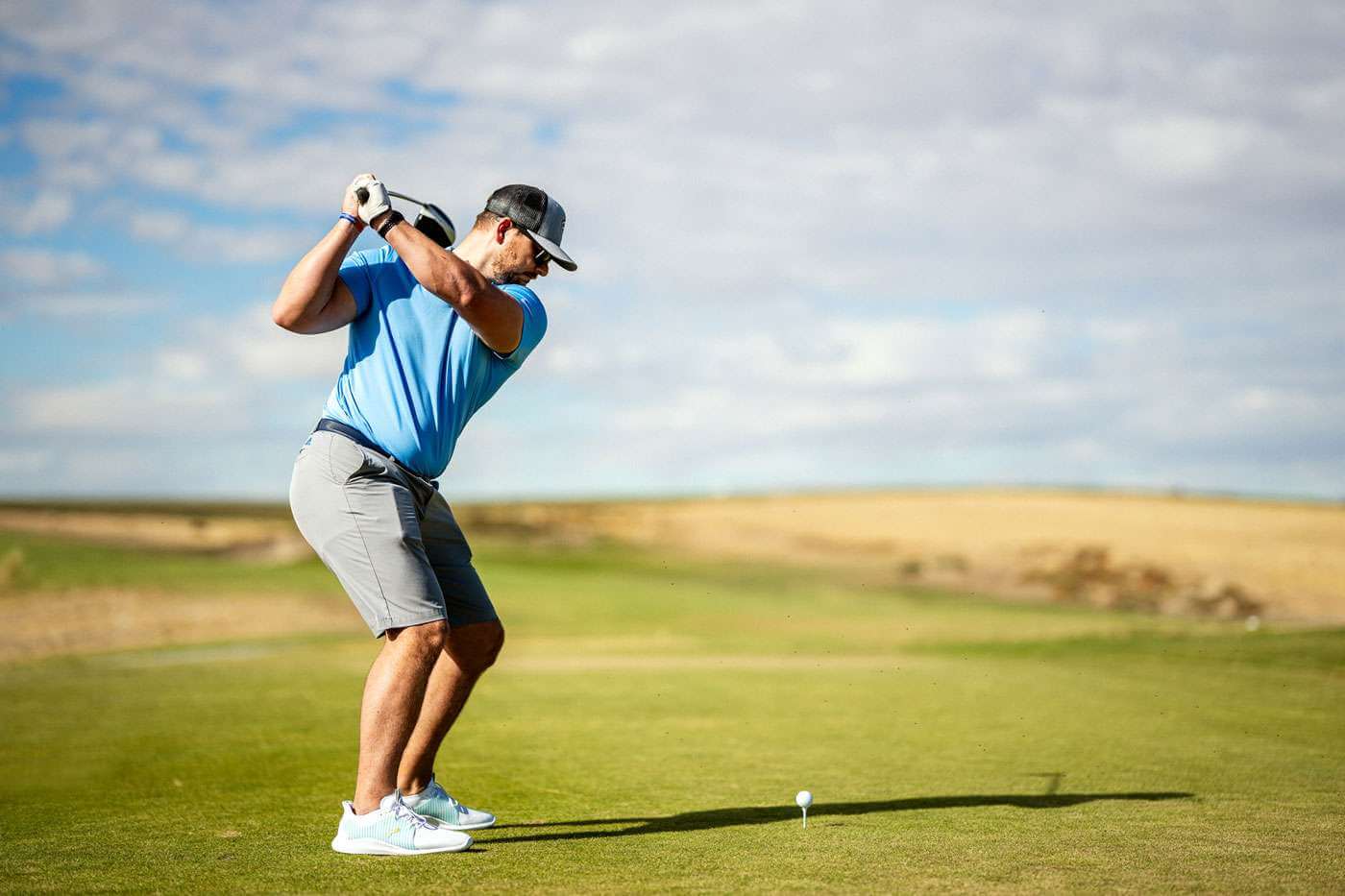 Man gets ready to take a swing while golfing