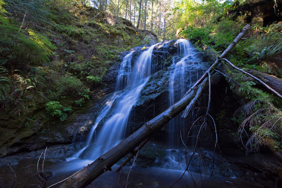 A waterfall cascades over rocks at Moran State Park on Orcas Island