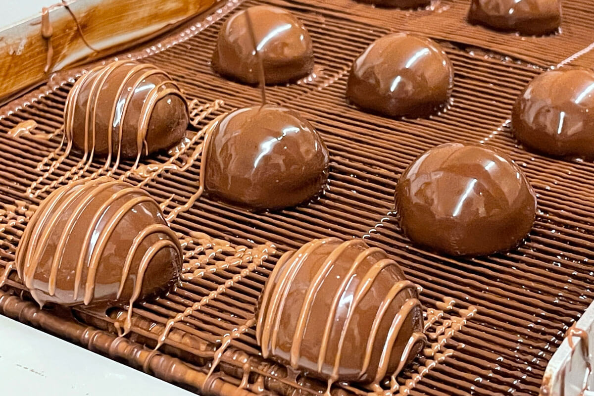 Chocolates are drizzled with a lighter layer of chocolate at Spokandy. 