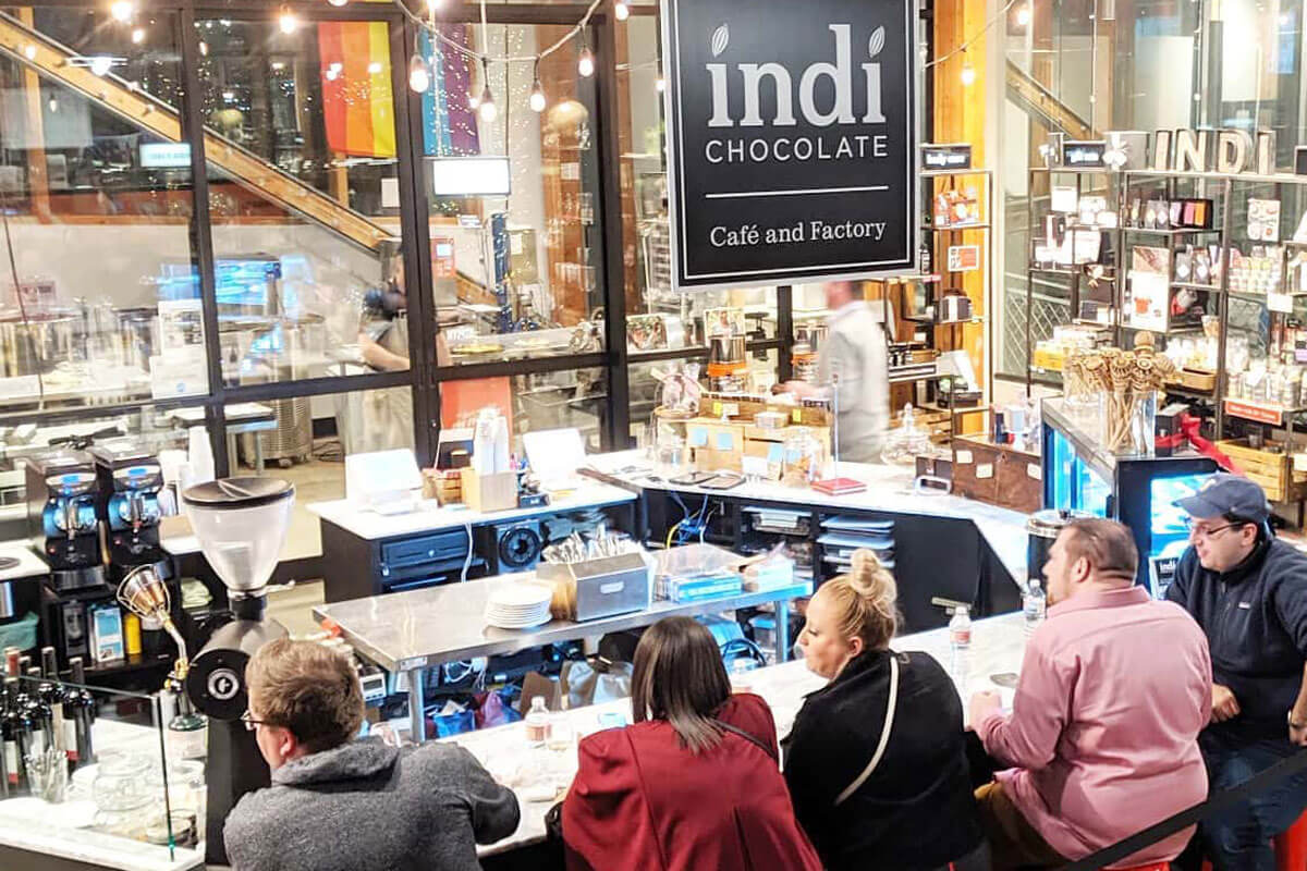People sit at the counter inside indi Chocolate, a great option for locally made Washington chocolate.