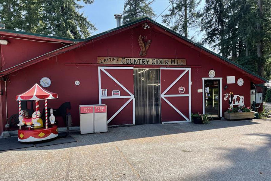 The exterior red barn of Lattin's Country Cider Mill & Farm