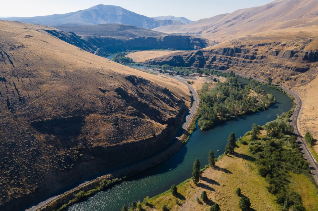 Brown desert hills of the Yakima River Canyon with a winding river