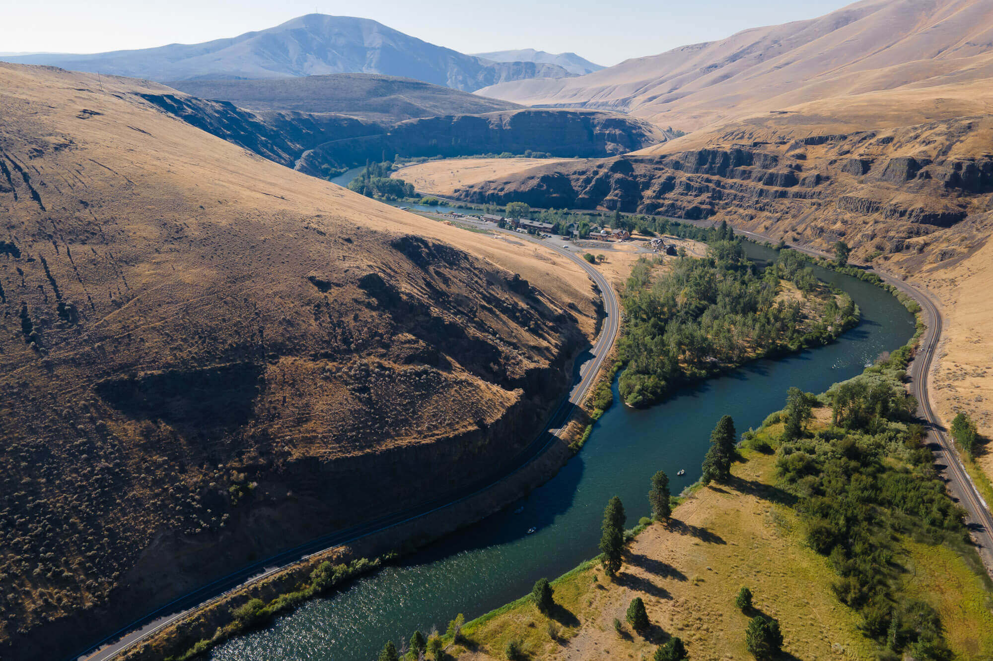 Brown desert hills of the Yakima River Canyon with a winding river