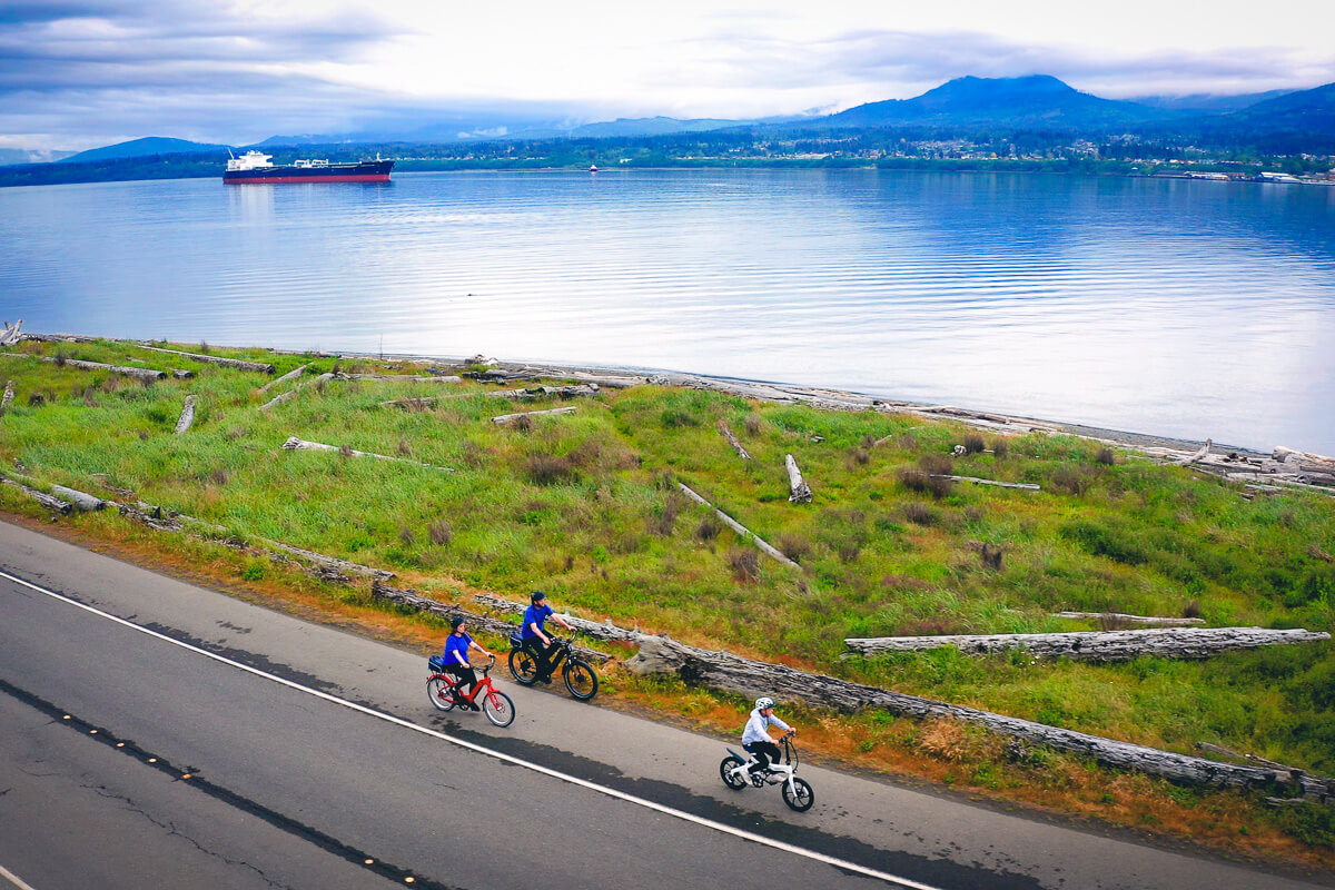 Three people bike along the Olympic Discovery Trail, one of many things to do in Port Angeles 
