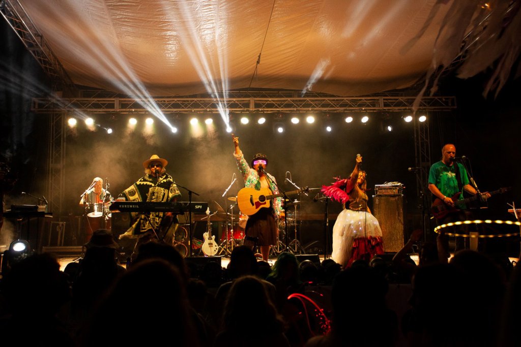 A group of musicians performs on stage during Departure Fest NW.