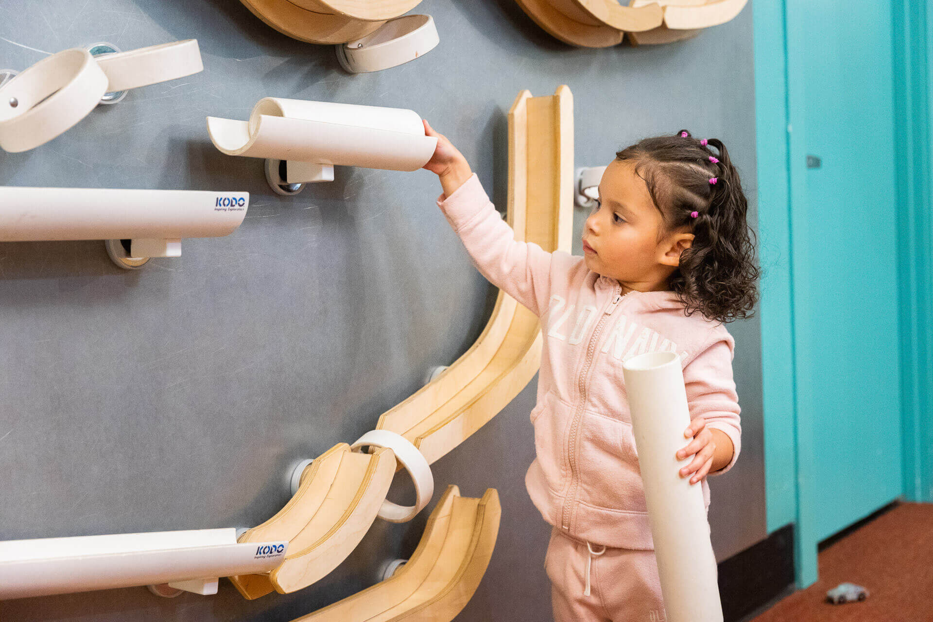 A child plays with an interactive wall exhibit at the Seattle Children's Museum.