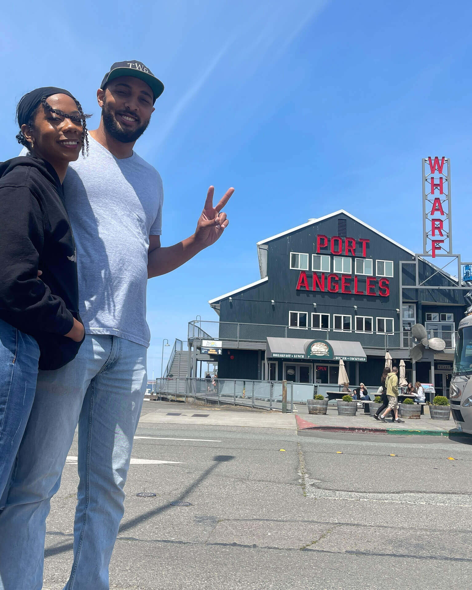 Anthony & Marlie Love stand in front of the Port Angeles Wharf building.