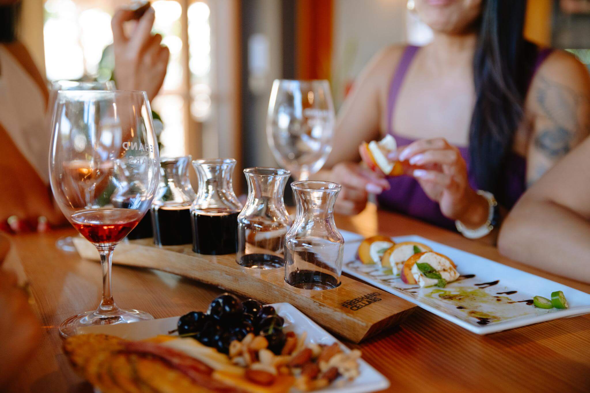 Guests dining and tasting wine at Freehand Cellars in Wapato