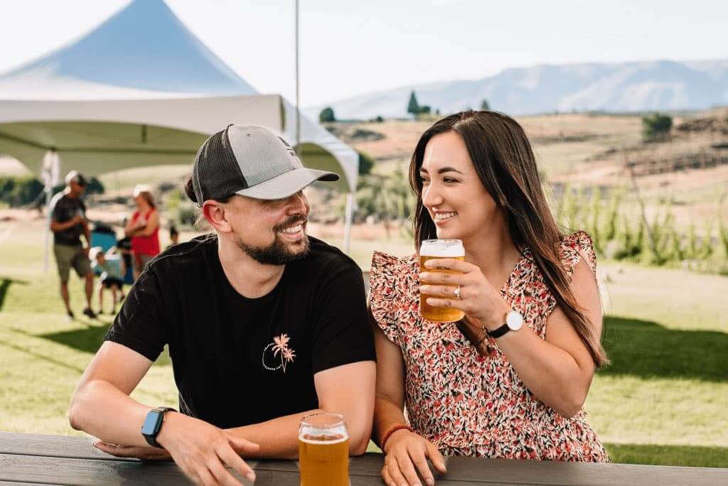 A couple sits in the outdoor area at Cowiche Creek Brewing Company in Yakima, WA. 