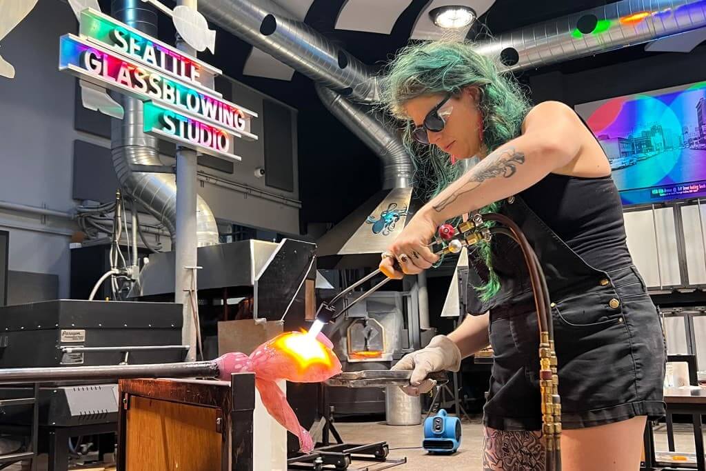 Artist Bri Chesler giving a demonstration at Seattle Glassblowing Studio.