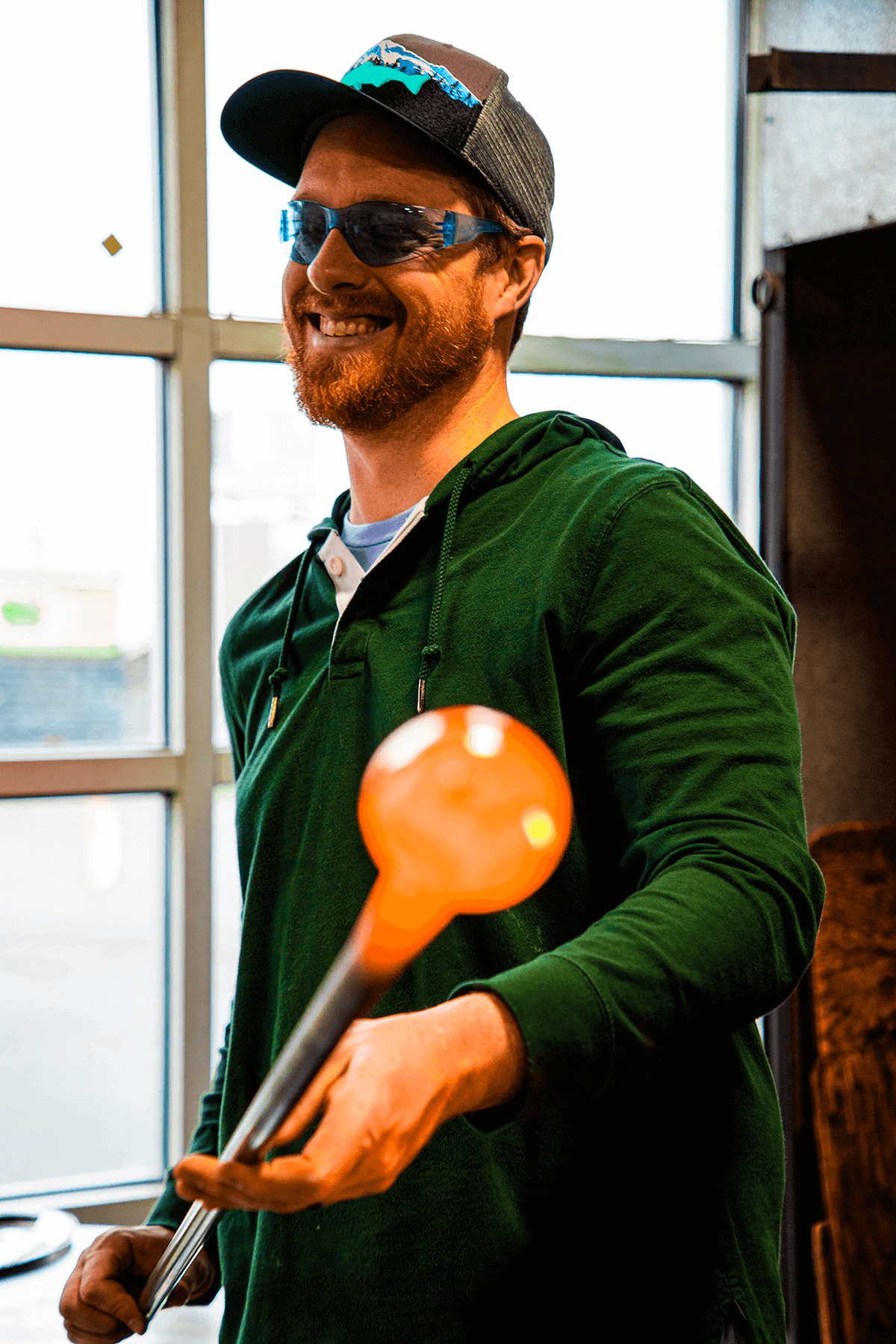 An artist demonstrating glassblowing at Tacoma Glassblowing Studio. 