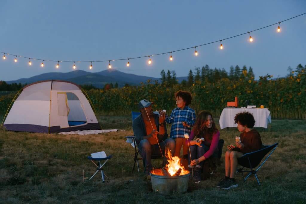 Family toasting marshmallows over a campfire in eastern Washington. 