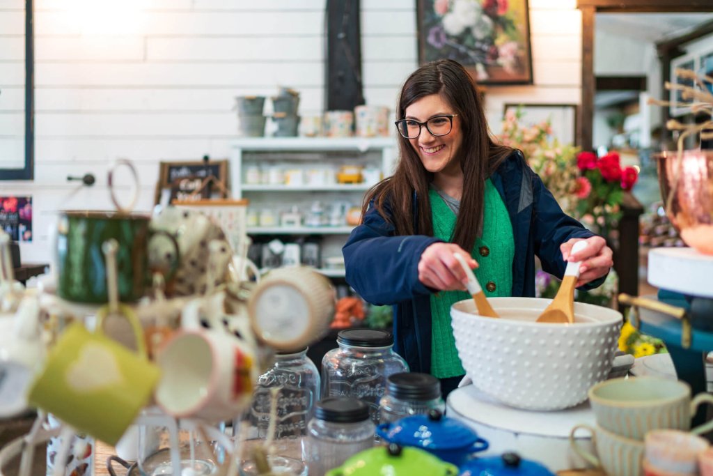 A woman browses home goods in a store