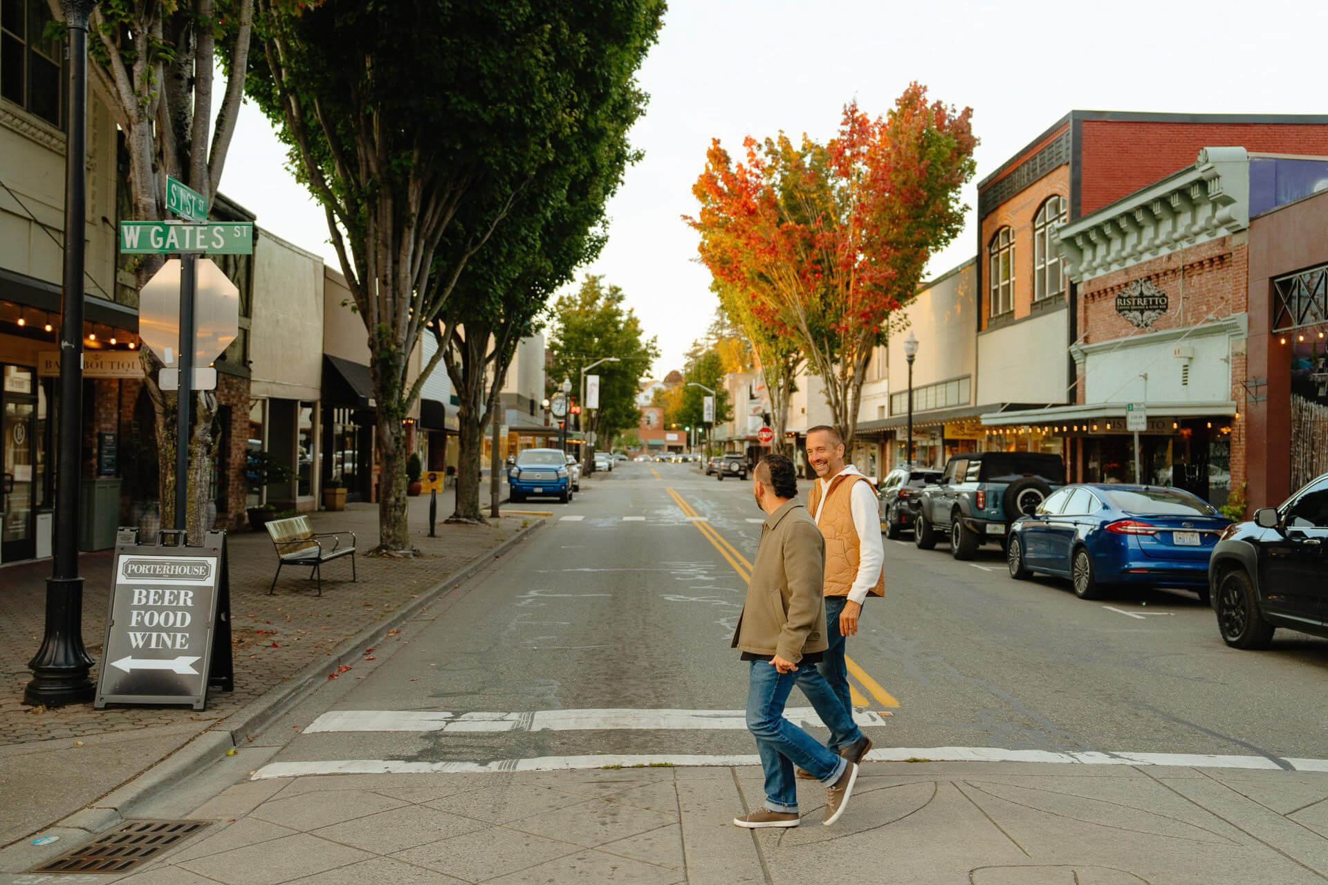 Photo of two men walking across the street in downtown Mount Vernon