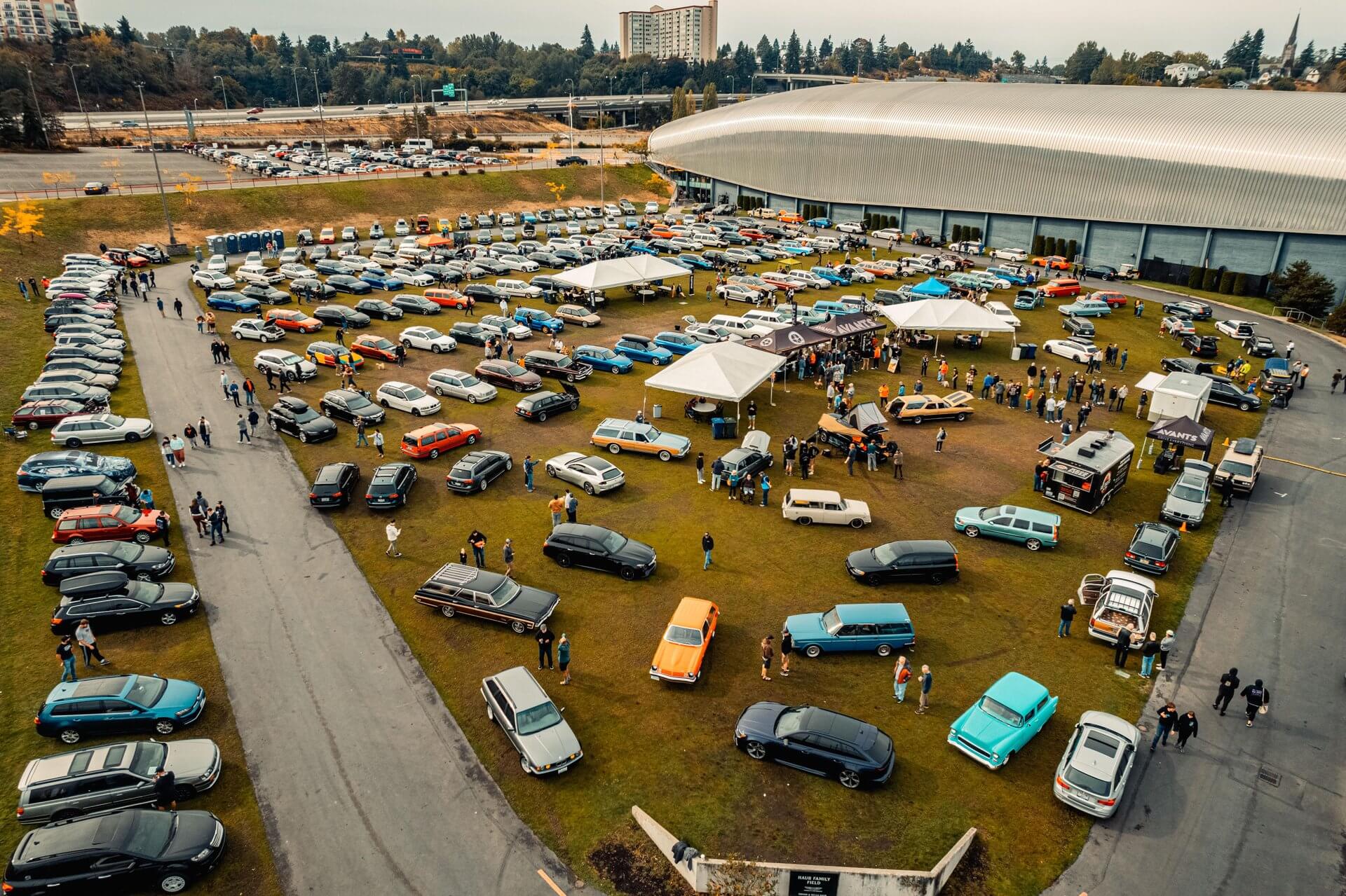 Vintage and modern cars are parked on a filed during car shows in Washington