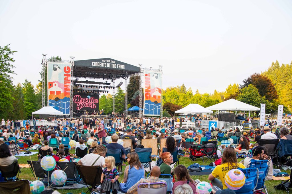 People sit in chairs during an outdoor concern in Carnation Washington
