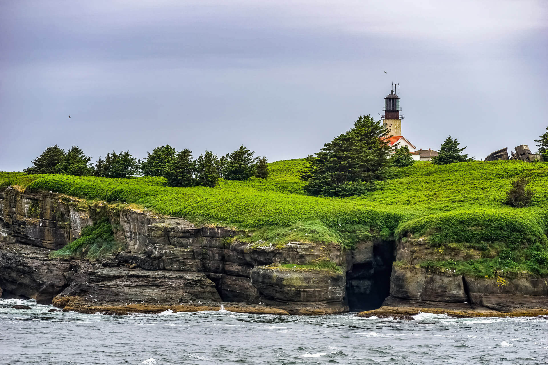 A lighthouse is seen along the coast