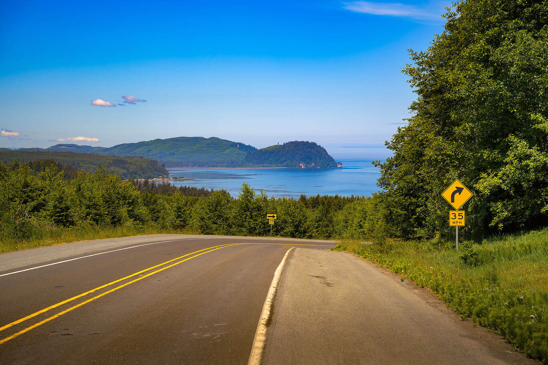 The a road along the Cape Flattery Tribal Scenic Byway leads toward water