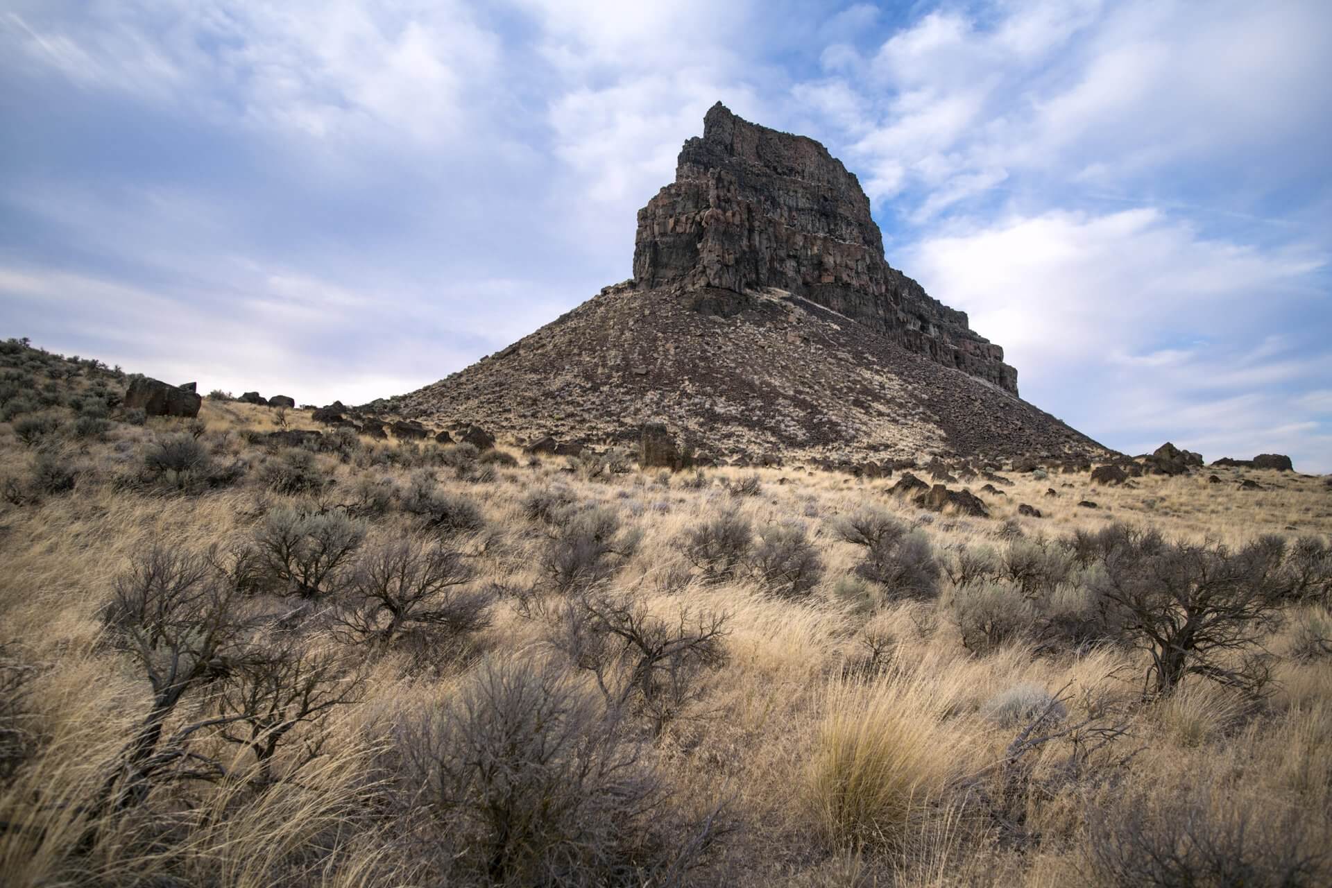 A rock formation and dry grassland along the Coulee Corridor