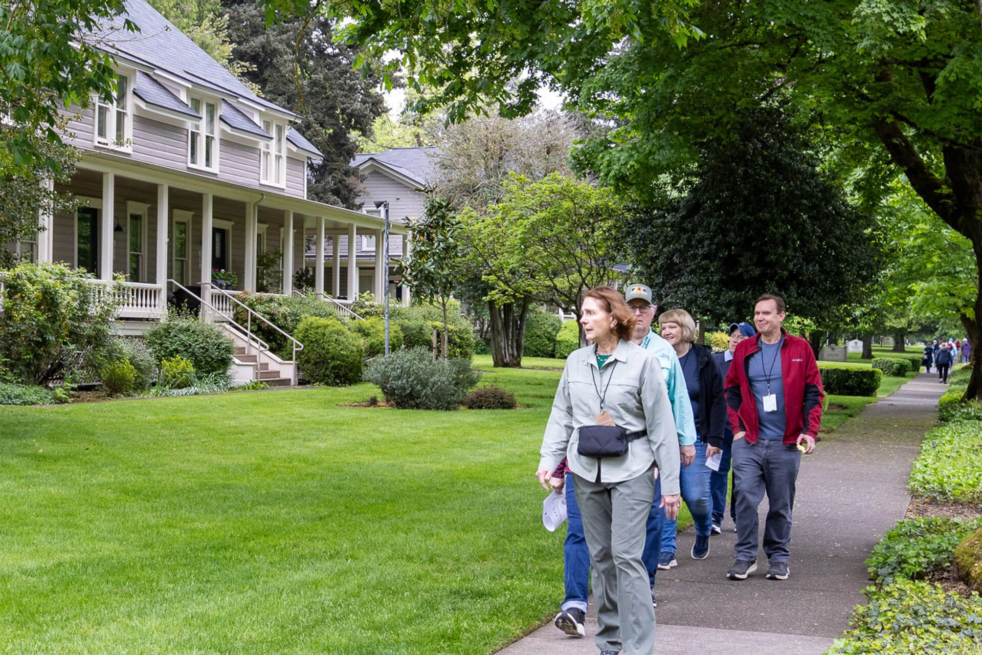 A tour group walks past houses on Officers Row