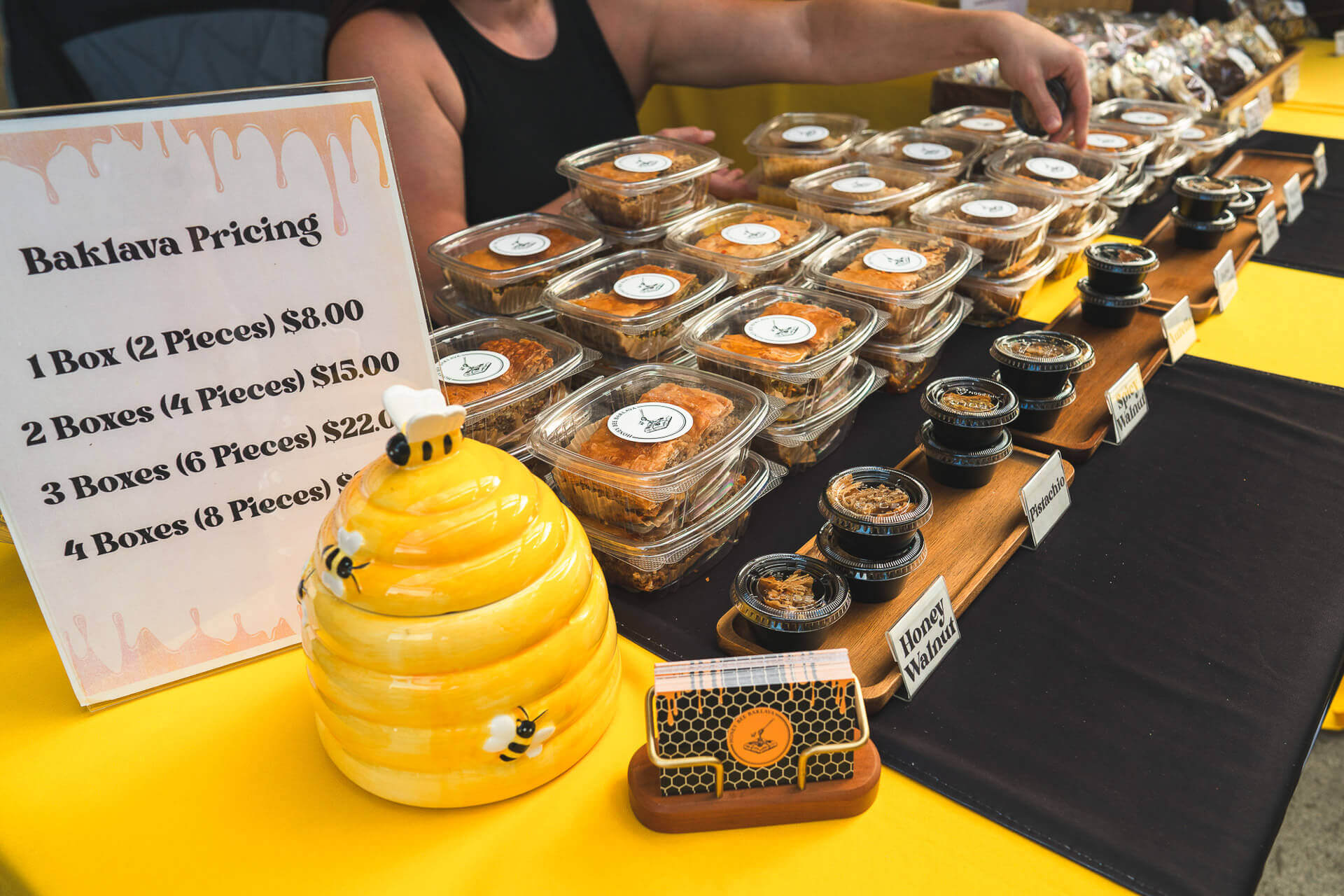 A vendor booth sells honey products at The Scale House Market in Spokane Valley