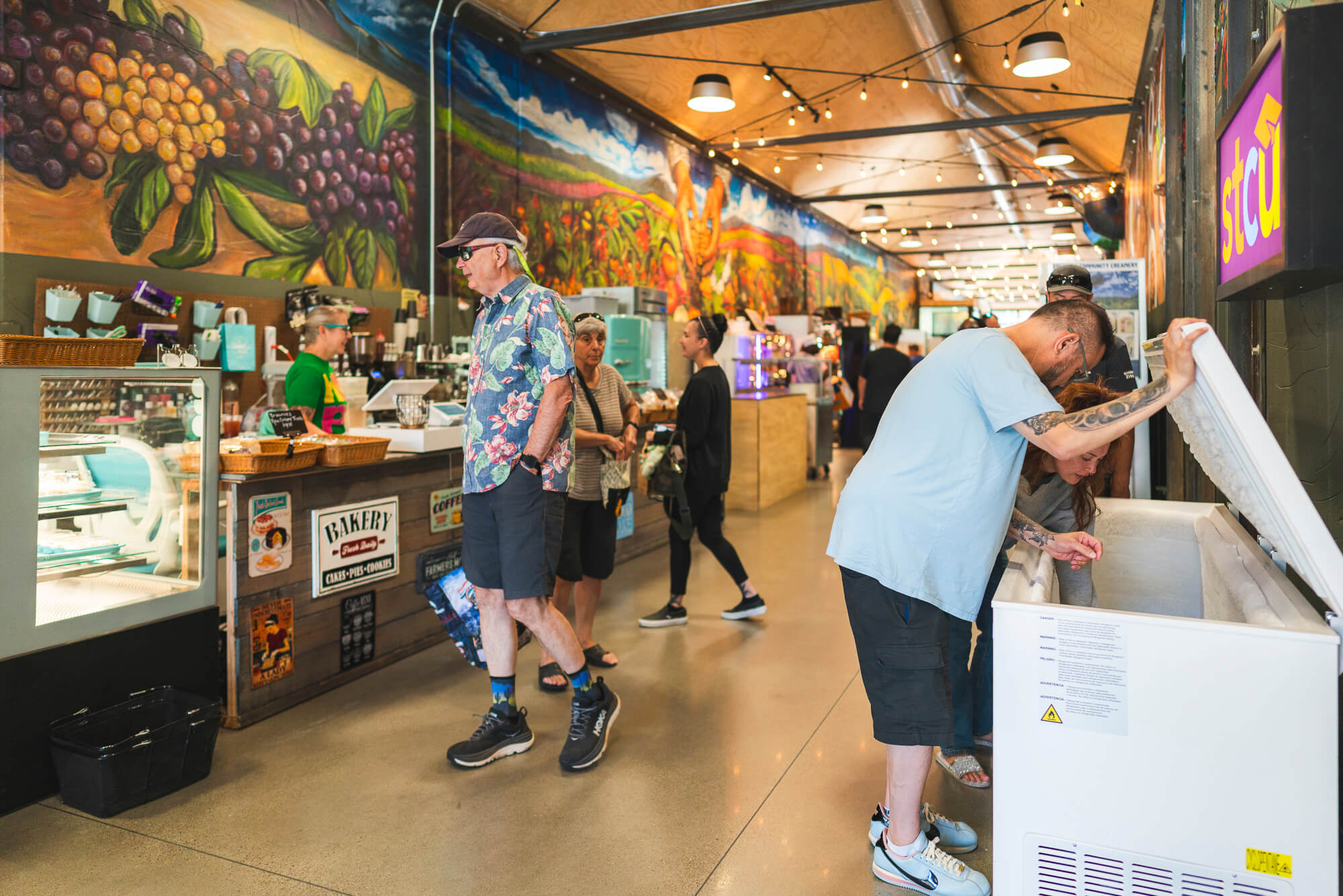 Customers shop at a local market
